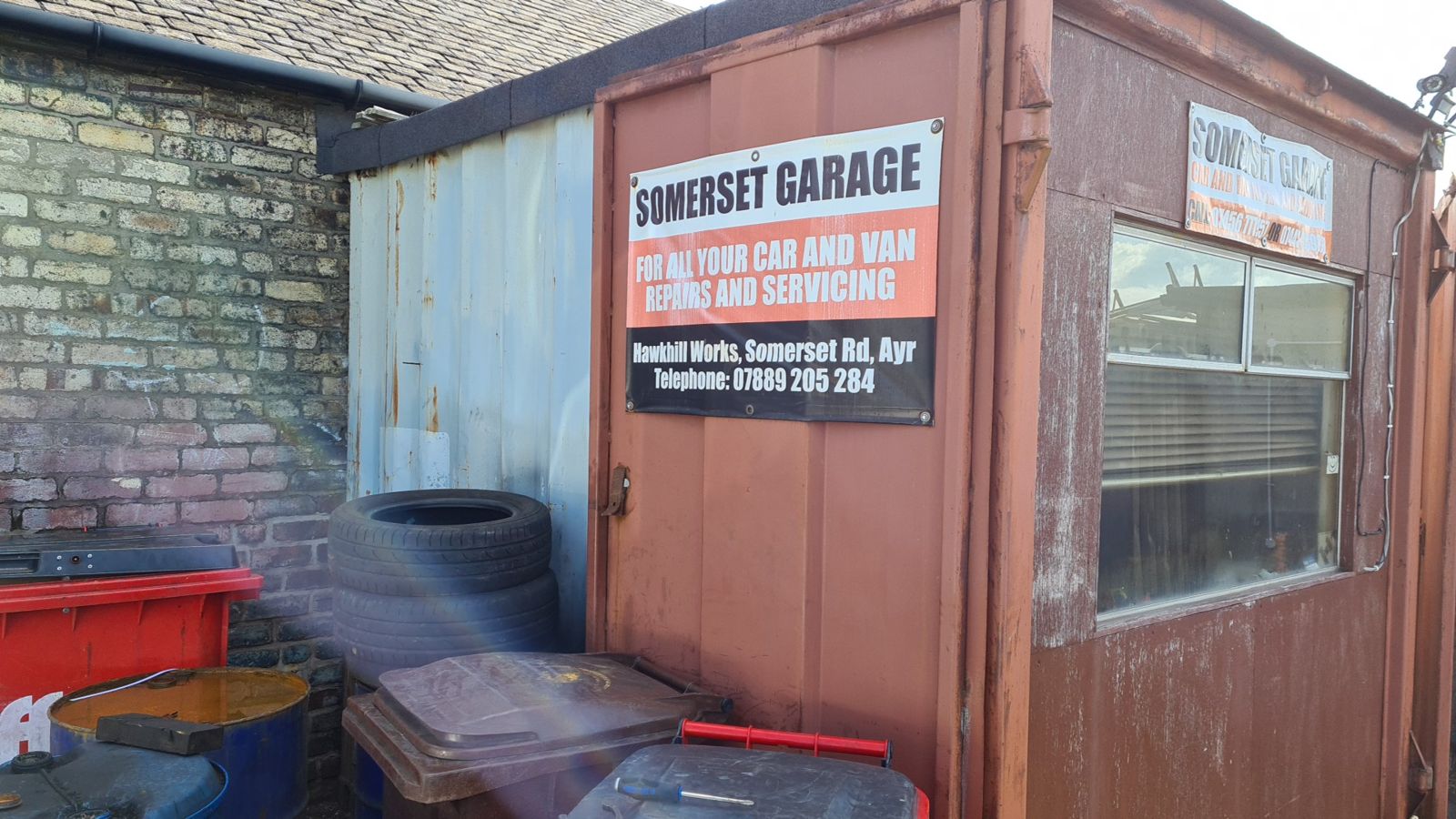 The Somerset Garage office at Hawkhill Works, with its sign for car and van repairs and servicing